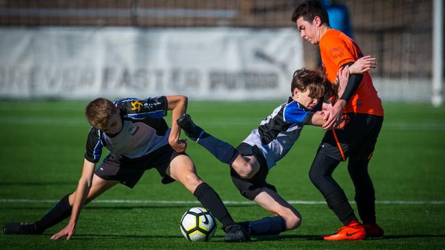 Rouse Hill Rams players Kai Wilson (left) and Aiden Kelly contest for the ball during their clash with Kemps Creek in the Football NSW under-14 State Cup Finals. Picture: Photosbyloopii/George Loupis