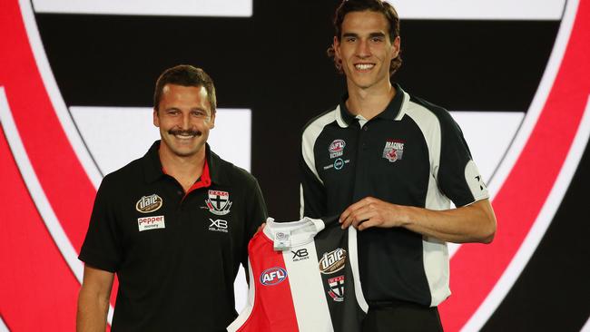 St Kilda captain Jarryn Geary presents No.4 pick Max King with his new guernsey. Picture: Michael Klein