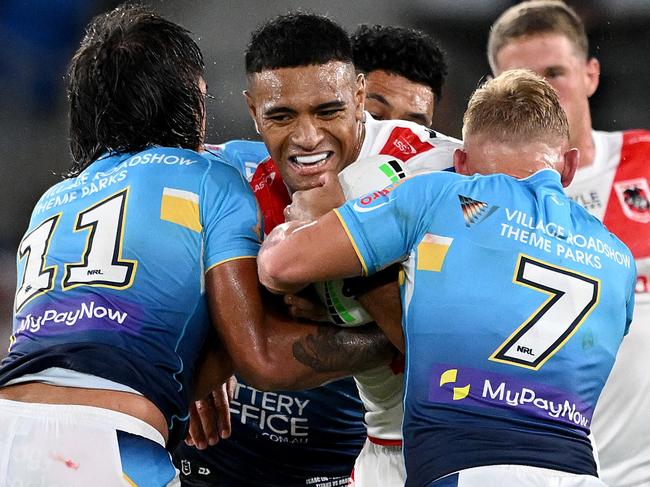 GOLD COAST, AUSTRALIA - MARCH 09: Viliami Fifita of the Dragons takes on the defence during the round one NRL match between the Gold Coast Titans and St George Illawarra Dragons at Cbus Super Stadium, on March 09, 2024, in Gold Coast, Australia. (Photo by Bradley Kanaris/Getty Images)