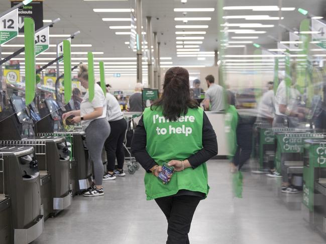 An employee supervises self-service checkout kiosks at a Woolworths Group Ltd. grocery store in Sydney, Australia, on Monday, Aug. 21, 2023. Woolworths is scheduled to release earnings results on Aug. 23. Photographer: Brent Lewin/Bloomberg via Getty Images