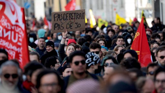 A protester holds a sign reading, ‘No pension, no Olympics.’ Picture: Lou Benoist/AFP