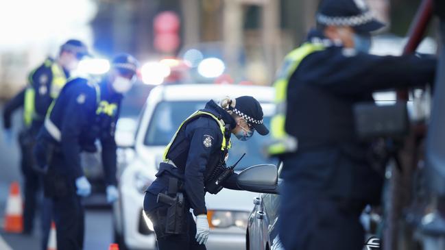 Police question drivers at a roadblock site in Broadmeadows, Melbourne. Picture: AAP