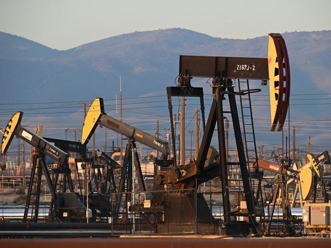 Active pump jacks increase pressure to draw oil toward the surface at the South Belridge Oil Field on February 26, 2022, in unincorporated Kern County, California, approximately 141 miles (227 km) northwest of Los Angeles, California. - From rural areas of the eastern states where modern oil production began to cities in southern California where pumpjacks loom not far from homes, lax regulations and the petroleum industryâs boom and busts cycles have left the US pockmarked with perhaps hundreds of thousands of oil wells that are unsealed and haven't produced in decades. In a first, Washington is making a concerted effort to plug these wells by allocating $4.7 billion in federal infrastructure dollars to plug the wells in an effort to lessen the negative health and environmental impact of the disused wells. (Photo by Robyn BECK / AFP)