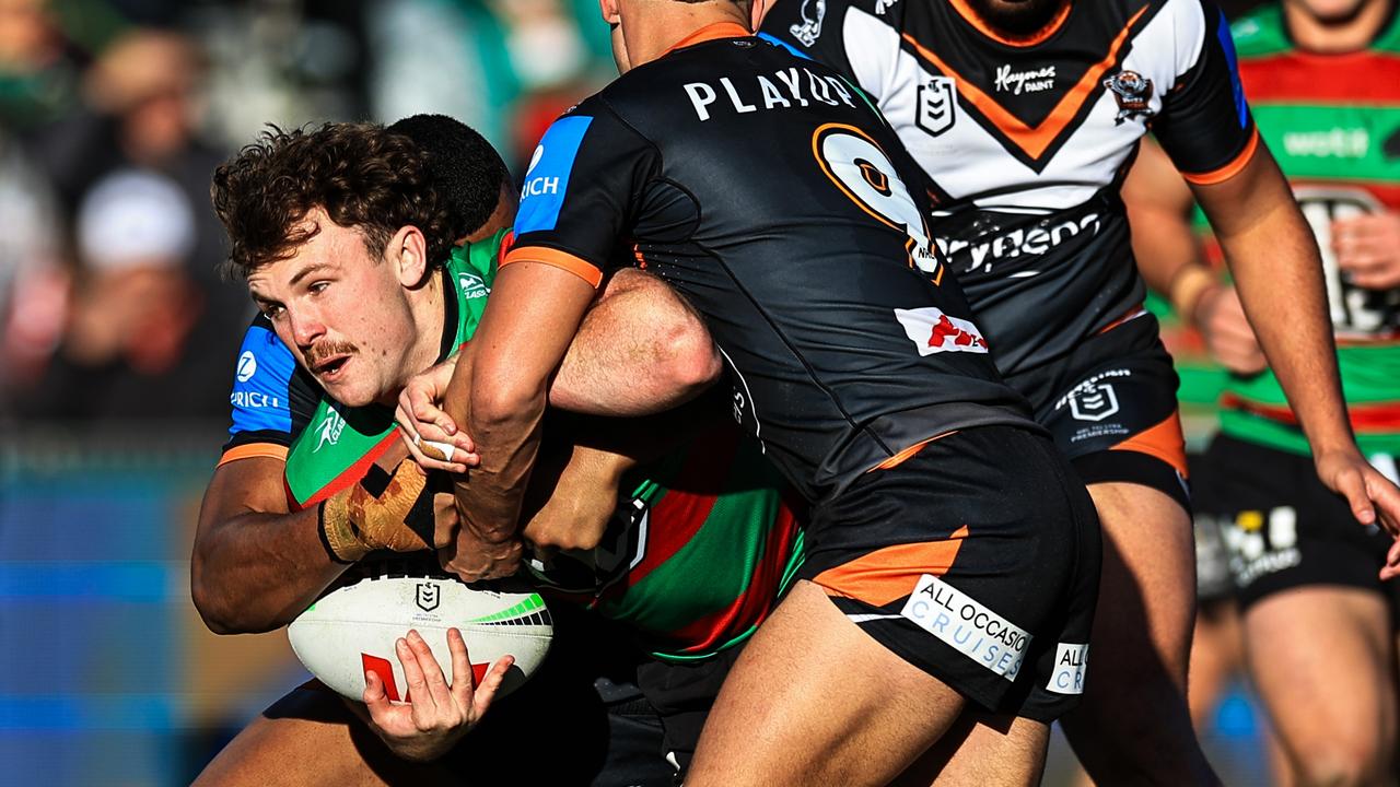 GOSFORD, AUSTRALIA - JULY 20: Liam Le Blanc of the Rabbitohs is tackled during the round 20 NRL match between South Sydney Rabbitohs and Wests Tigers at Industree Group Stadium, on July 20, 2024, in Gosford, Australia. (Photo by Mark Evans/Getty Images)