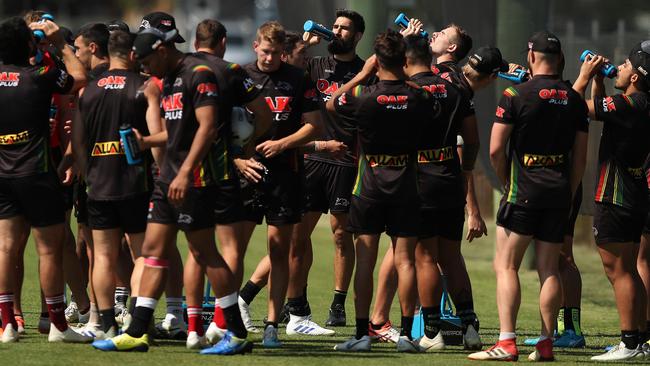 Penrith players have a drink during Penrith NRL training on a hot Sydney day in Penrith. Picture: Brett Costello