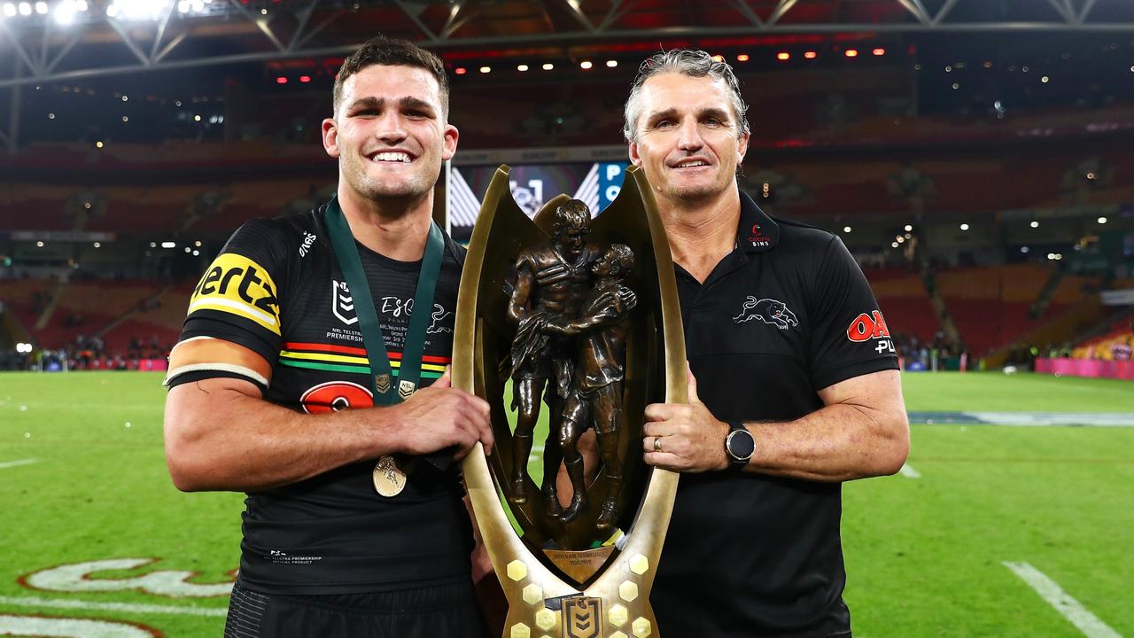 BRISBANE, AUSTRALIA - OCTOBER 03: Nathan Cleary of the Panthers and Panthers coach Ivan Cleary pose with the NRL Premiership Trophy after victory in the 2021 NRL Grand Final match between the Penrith Panthers and the South Sydney Rabbitohs at Suncorp Stadium on October 03, 2021, in Brisbane, Australia. (Photo by Chris Hyde/Getty Images)