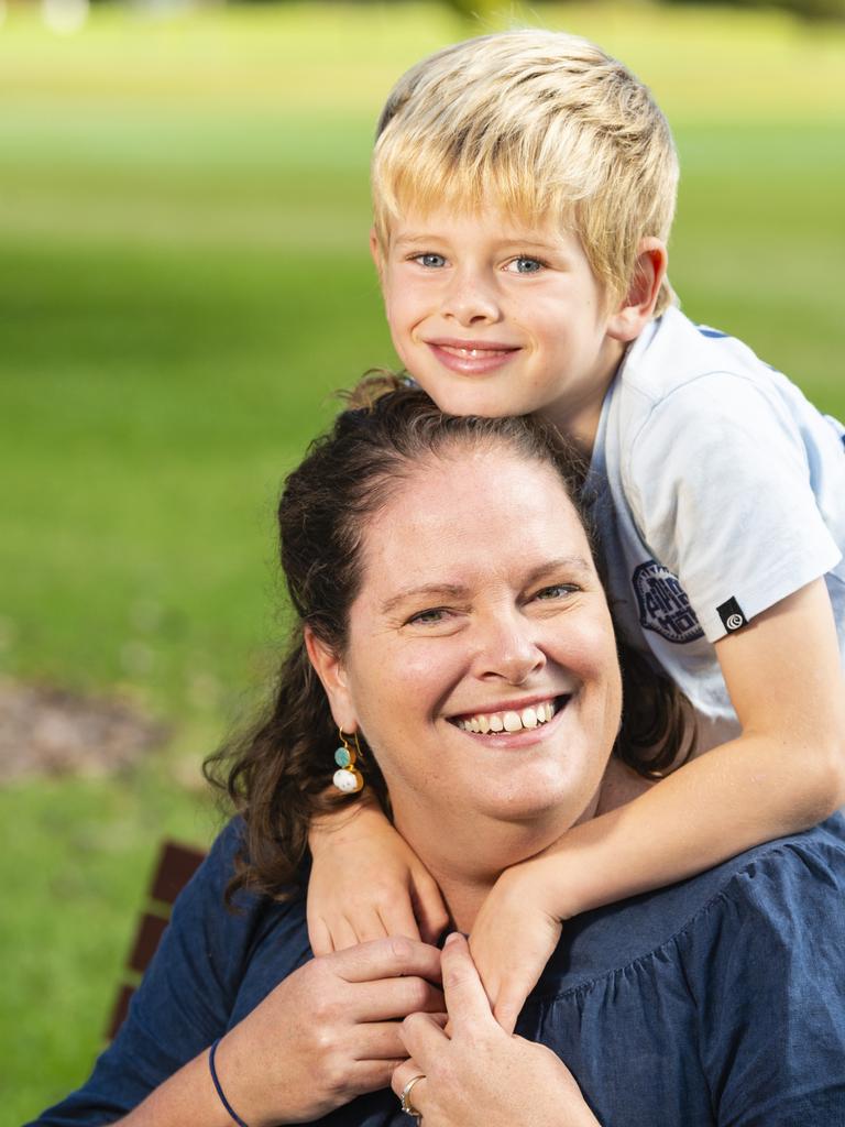 Pax Howden gives mum Claire Howden a hug for Mother's Day during celebrations in the Queensland State Rose Garden, Newtown Park, Sunday, May 8, 2022. Picture: Kevin Farmer