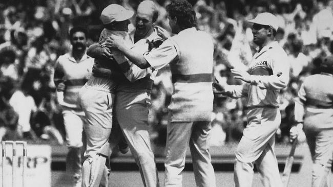 Wicketkeeper Ian Healy hugs his Queensland and Australian team mate Carl Rackerman. Pic Darren Tindale. Cricket