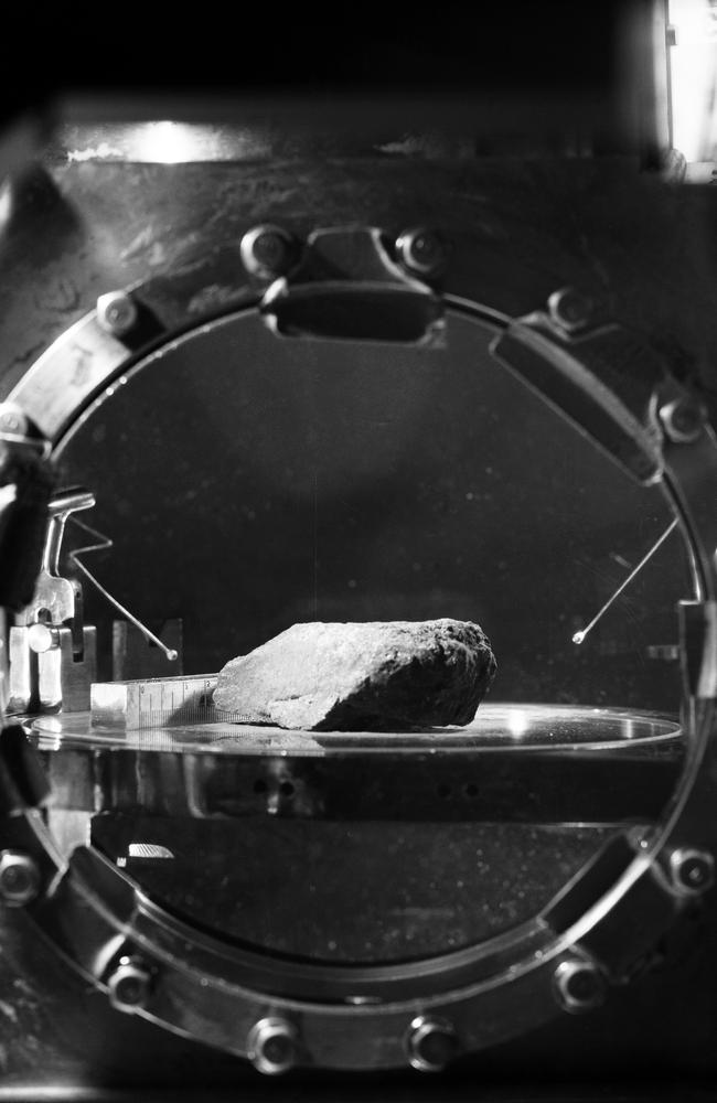 The first lunar sample that was photographed in detail in the Lunar Receiving Laboratory at the Manned Spacecraft Center. The photograph shows a granular, fine-grained, mafic (iron magnesium rich) rock. At this early stage of the examination, this rock appears similar to several igneous rock types found on Earth. This rock was among the samples collected by astronauts Neil A. Armstrong and Edwin E. Aldrin Jr. during their lunar surface extravehicular activity on July 20, 1969.