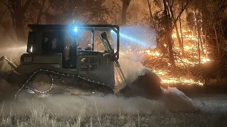 Morley's Earthmoving excavator creating a containment line for the fire brigade in Cranbrook. Photo: Tom Warren