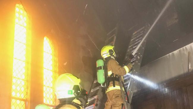 NSW Fire &amp; Rescue crews at the St Carthage's Cathedral in Lismore. Photo: Alison Paterson