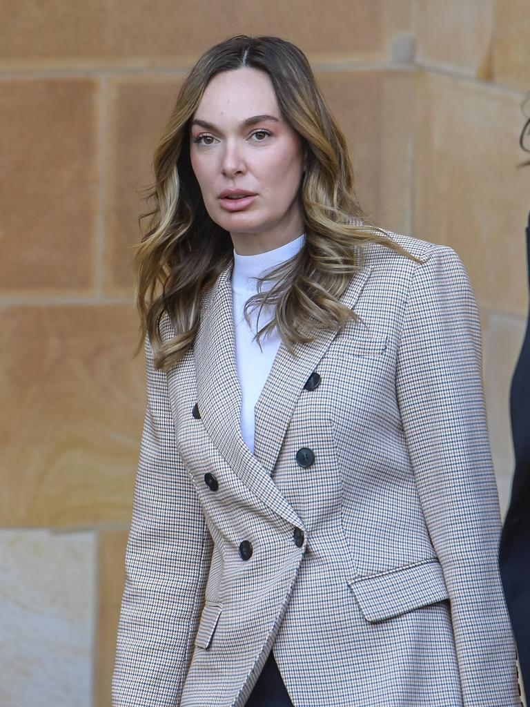 Ms Pupa leaves the Adelaide Magistrates Court after her first appearance. Picture: Roy VanDerVegt.