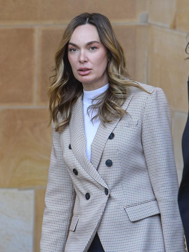 Ms Pupa leaves the Adelaide Magistrates Court after her first appearance. Picture: Roy VanDerVegt.