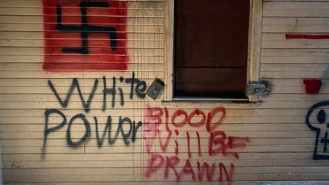 Racist neo-Nazi graffiti scrawled on an abandoned Commonwealth building close to a popular walking trail at Bantry Bay, near Killarney Heights. It could be part of a local racist recruitment campaign, an expert said. Picture: Supplied