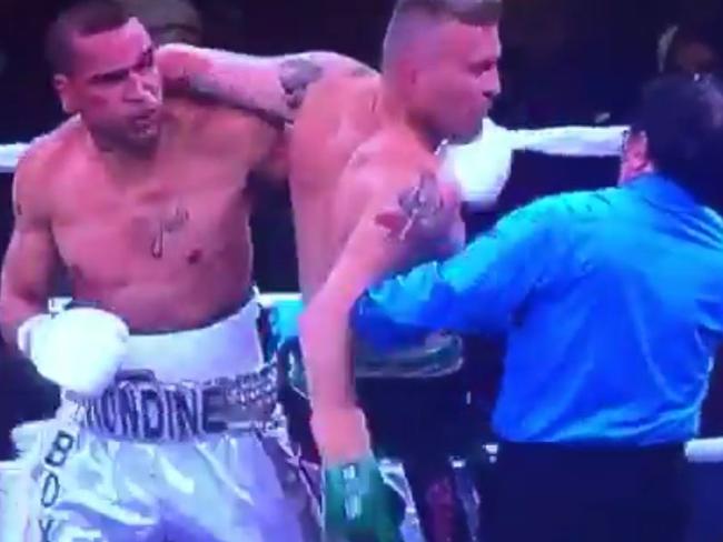 Mundine catches an off-guard Green.