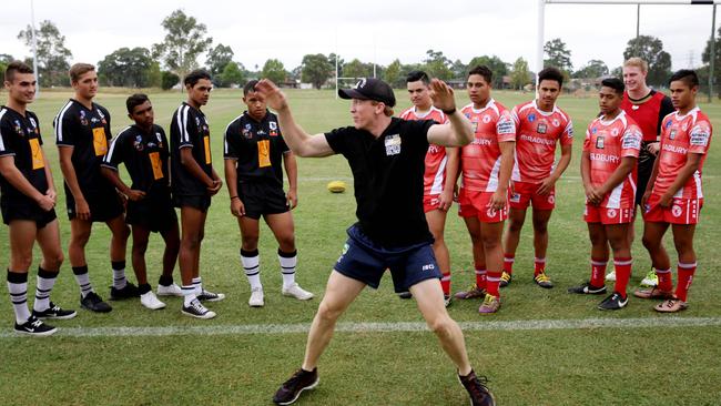 Alan Tongue leads a discussion about domestic violence with players from Easts Campbelltown and the Redfern All Blacks. Picture: Peter Kelly