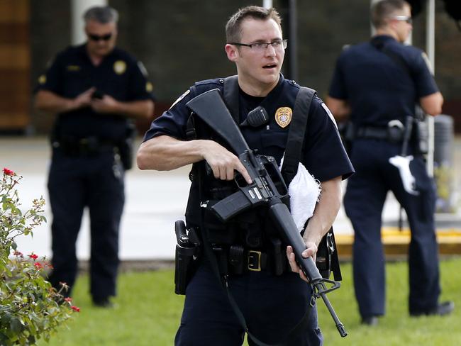 Police guard the emergency room entrance of Our Lady Of The Lake Medical Centre, where wounded officers were taken, in Baton Rouge. Picture: AP Photo/Gerald Herbert