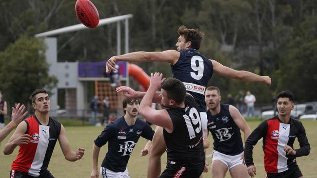 EFL: Berwick’s Jayden Graham crashes the pack. Picture: Valeriu Campan