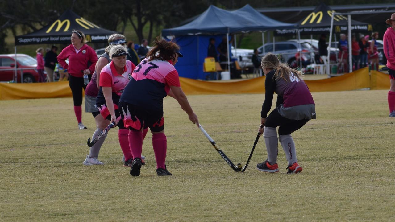 Joan Norton (Toowoomba) and Noelle Cavanagh (Gladstone) battling it out at the 2021 Queensland Hockey Women's Masters Championships.