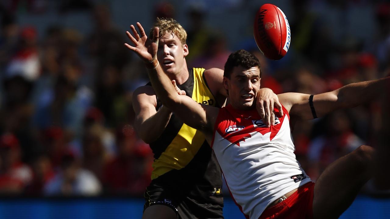 MELBOURNE, AUSTRALIA - APRIL 03: Tom J. Lynch of the Tigers and Tom McCartin of the Swans  compete during the round 3 AFL match between the Richmond Tigers and the Sydney Swans at Melbourne Cricket Ground on April 03, 2021 in Melbourne, Australia. (Photo by Darrian Traynor/Getty Images)