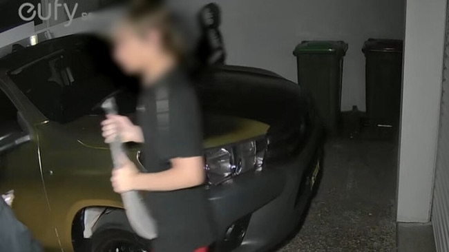 One of the teenagers carrying a large machete. Picture: Supplied.