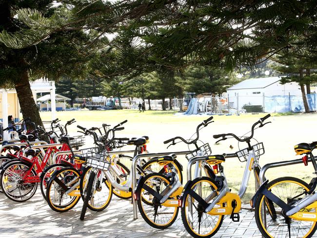 Hire bikes over flow out of a bike rack at Goldstein Reserve at Coogee Beach. Picture: John Appleyard