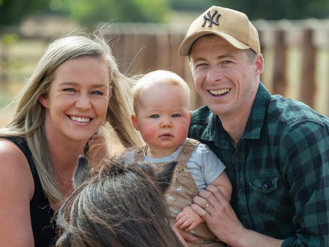 Jockey Harry Coffey with his wife, Tayla, their 10-month-old son, Thomas, and Shetland pony Bruno on their Swan Hill property. Picture: Jay Town/VRC