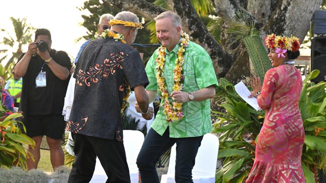 Prime Minister Anthony Albanese dances before receiving a gift during a welcome ceremony the Pacific Islands Forum in Aitutaki, Cook Islands. (AAP Image/Mick Tsikas)