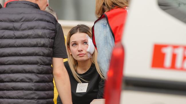 Family members surround one of the victims at the garden of Kocani General Hospital in Kocani, North Macedonia. Picture: Ferdi Limani/Getty Images