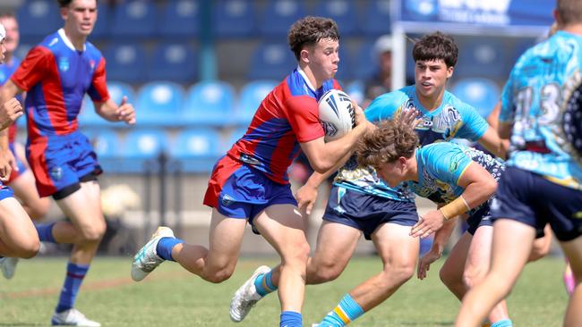 Charlie Burey taking on the Titans’ defence. Picture: DC Sports Photography