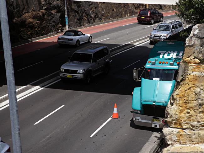 A petrol tanker was forced into the rock wall along Manly Rd, Seaforth, after being hit by a drink driver. Picture: Adam Yip