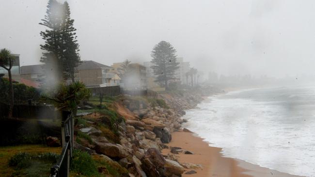 Large seas threaten homes along Narrabeen Beach on Tuesday morning. Picture: NCA NewsWire / Jeremy Piper