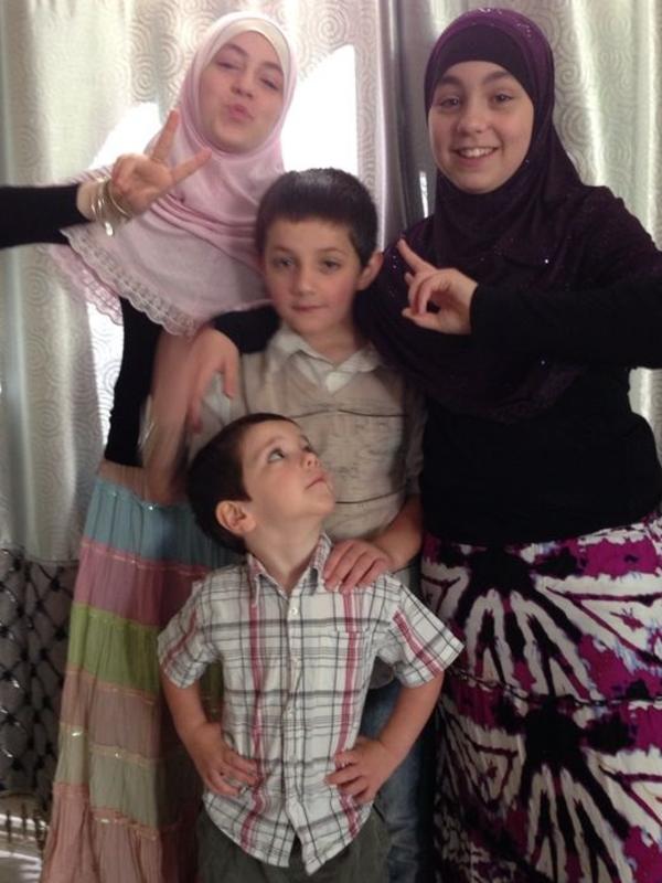 Two of the five children believed to be stuck in Syria, pictured wth their late mother.