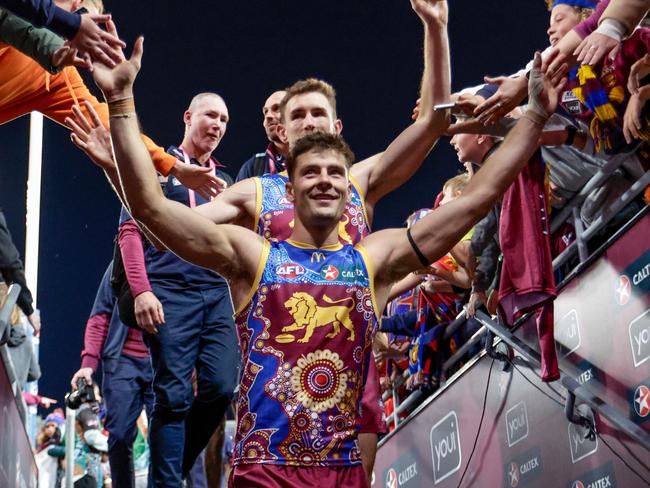 BRISBANE, AUSTRALIA - MAY 20: Brisbane Lions players acknowledge the crowd during the 2023 AFL Round 10 match between the Brisbane Lions and the Gold Coast Suns at The Gabba on May 20, 2023 in Brisbane, Australia. (Photo by Russell Freeman/AFL Photos via Getty Images)