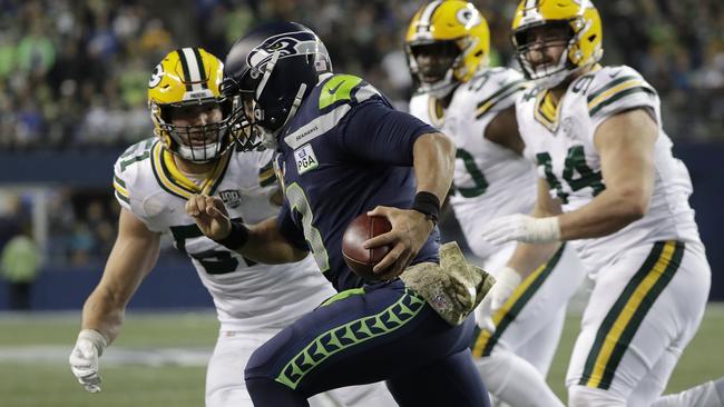 Kyler Fackrell moving in to take down Seattle Seahawks quarterback Russell Wilson (AP Photo/Elaine Thompson)