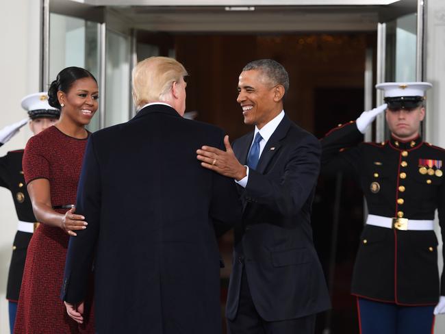 Incoming President Donald Trump is greeted by US President Barack Obama and First Lady Michelle Obama as he arrives at the White House in Washington, DC on January 20, 2017. Picture: AFP