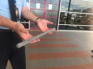 Darling Downs City Patrol Group Acting Inspector Matt Howard with one of the 50cm metal poles found near the incident scene where a Laidley Heights woman, 60, was impaled while driving west on the Warrego Highway near Oakey on Monday. Picture: Tara Miko