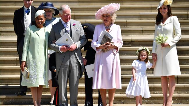 Doria Ragland, Prince Charles, Prince of Wales, Camilla, Duchess of Cornwall, and Catherine, Duchess of Cambridge holding her daughter Princess Charlotte's hand.