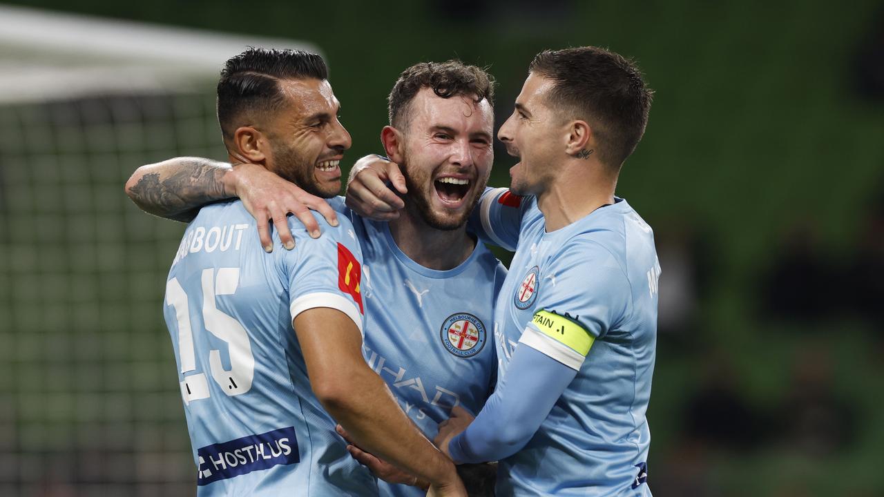 Andrew Nabbout (left) and Jamie Maclaren (right) congratulate Melbourne City goalscorer Aiden O'Neill at AAMI Park. Picture: Darrian Traynor/Getty Images