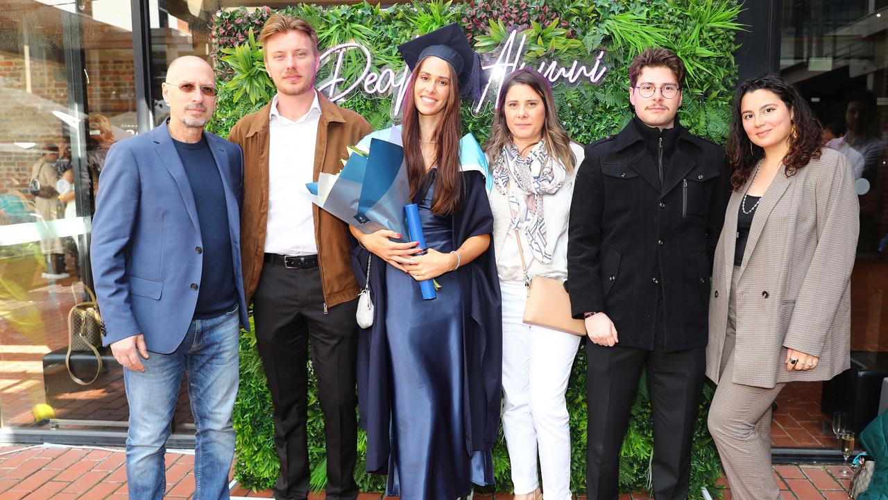 Deakin University graduate Nichole Costantino with Dad Alfredo Costantino, husband Damon Shemmeld, Mum Romina Lamanna, brother Matteo Costantino and cousin Naomi Costantino. Picture: Alison Wynd