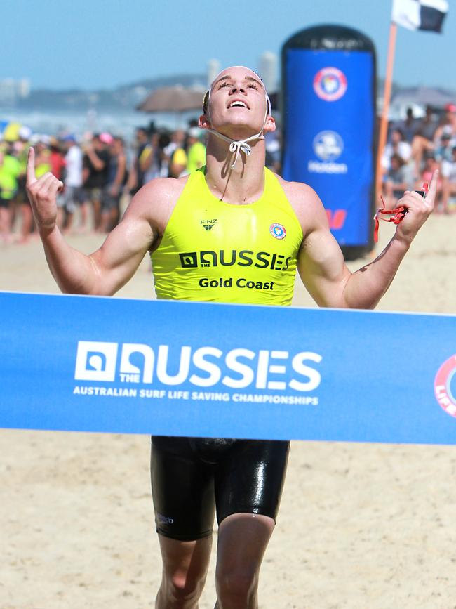 Mitch Coombes couldn't contain his emotion as he crossed the finish line of the under 19 ironman race. Picture: Harvpix