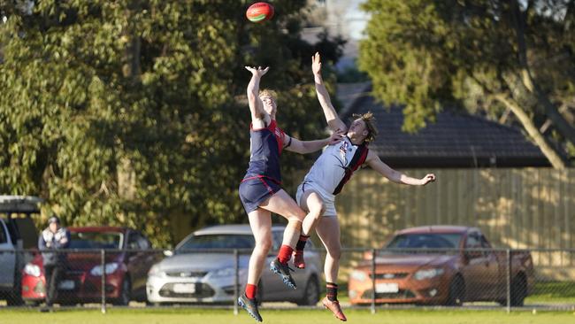 SFNL: Angus Macpherson (Chelsea Heights) and Nathan Stokes (Hampton Park) jump in the ruck. Picture: Valeriu Campan