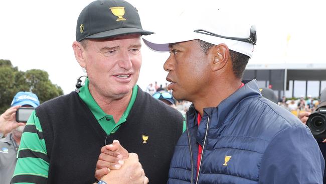 Tiger Woods and Ernie Els shake hands after the United States take the Presidents Cup at Royal Melbourne.