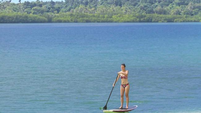 A visitor takes part in some stand-up paddleboarding on Erakor Lagoon; middle, Ramada Resort Port Vila; and right, the stunning scenery during the Off-Road Buggy Adventure in Port Vila. Picture: MAURO RISCH PHOTOGRAPHY +61 430