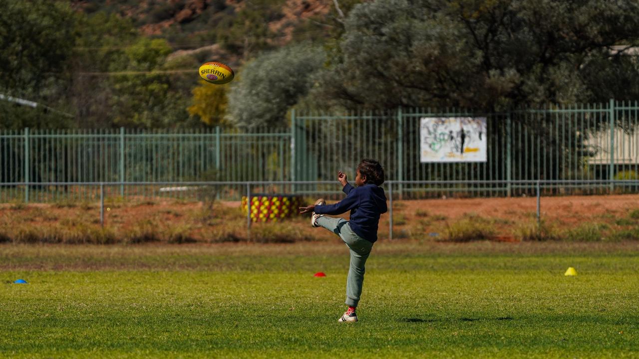 Melbourne Demons players Shane McAdam and Andy Moniz-Wakefield went to Santa Teresa ahead of the 2025 AFL game in Alice Springs. Picture: Melbourne Demons