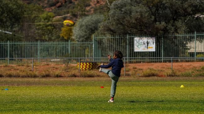Melbourne Demons players Shane McAdam and Andy Moniz-Wakefield went to Santa Teresa ahead of the 2025 AFL game in Alice Springs. Picture: Melbourne Demons
