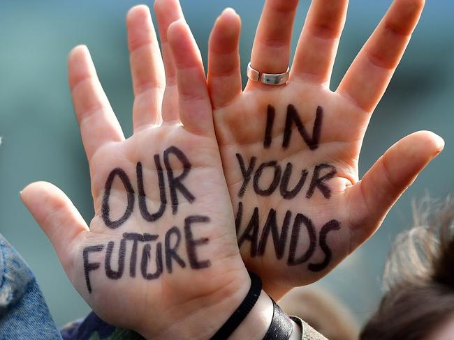 Students take part in a march for the environment and the climate o, in Brussels, on February 21, 2019. - Greta Thunberg, the 16-year-old Swedish climate activist who has inspired pupils worldwide to boycott classes, urged the European Union on February 21, 2019 to double its ambition for greenhouse gas cuts. (Photo by EMMANUEL DUNAND / AFP)