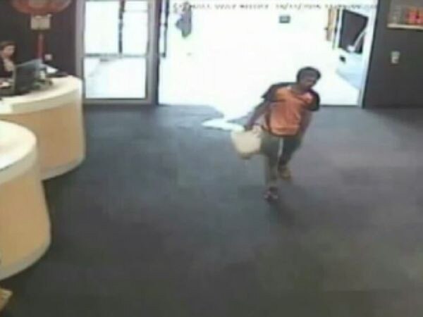 CCTV footage shows Nur Islam walking into the CBA in Springvale with a fuel container.