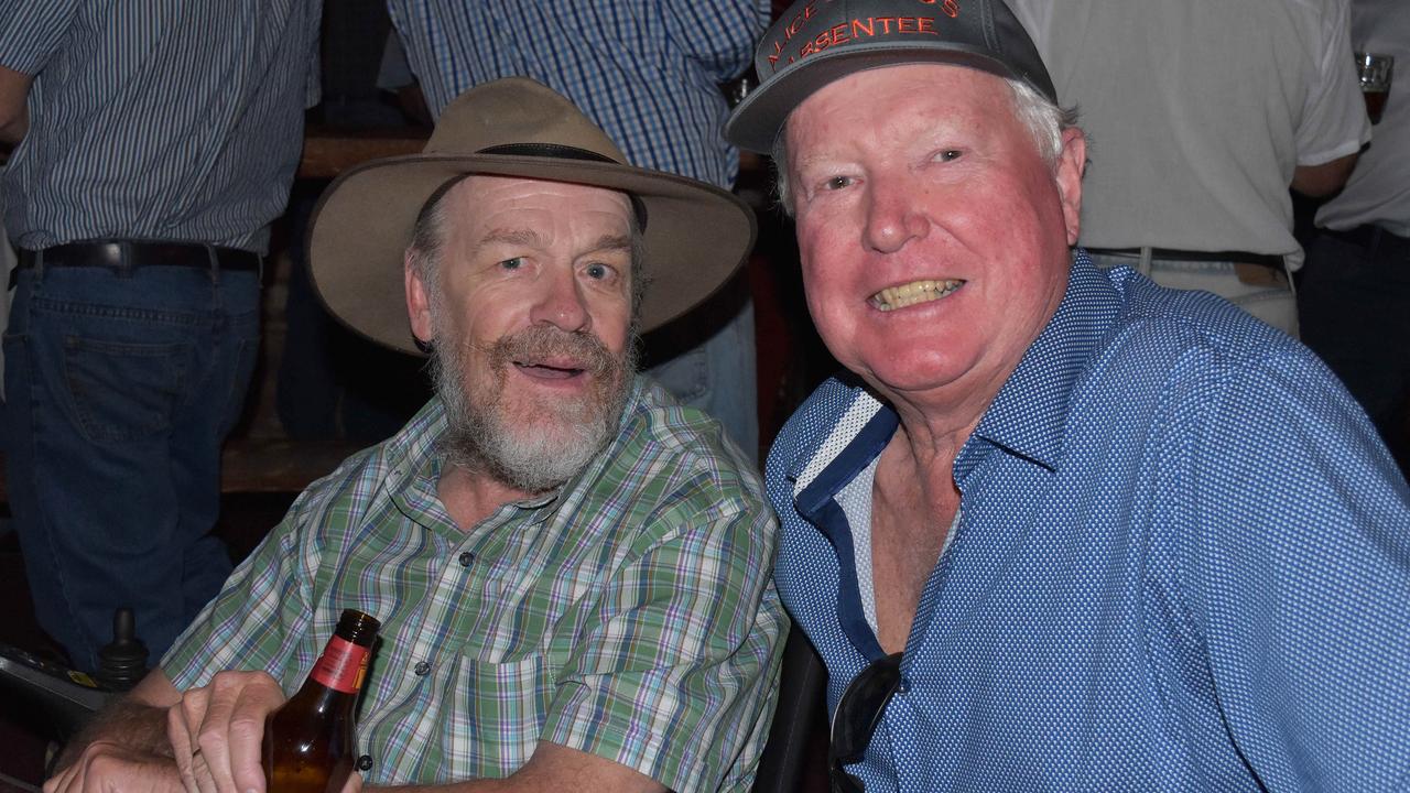 Chris Turner and Barry Browse celebrating Wayne Kraft's retirement from managing the Overlanders Steakhouse in Alice Springs.