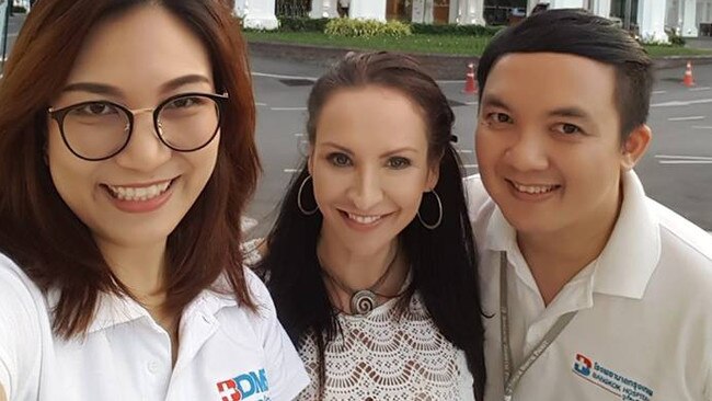 Gold Coast woman Claire Johnson (centre) with friends from the medical industry in Thailand. The former medi-tour operator has been detained in a Bangkok immigration detention centre. Photo: Facebook.